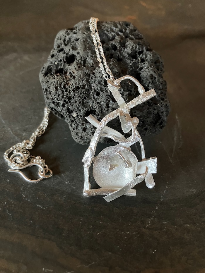 Shipwrecked Bowl silver pendant created from scrap silver pieces by silversmith Yvonne Doney